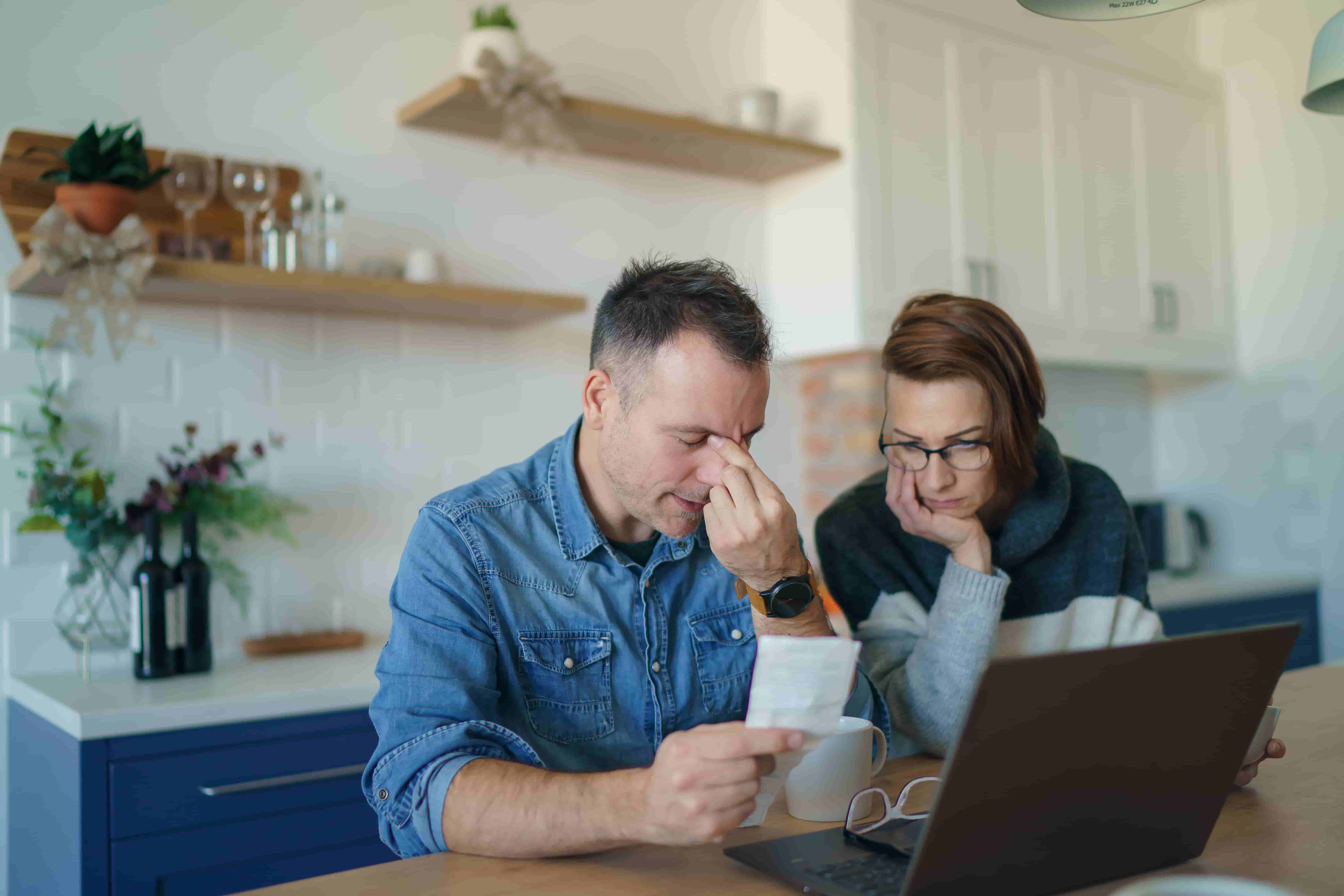 Middle age couple talking about financial plan